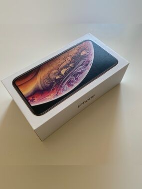 Empty iPhone Xs Gold Box and Apple Stickers